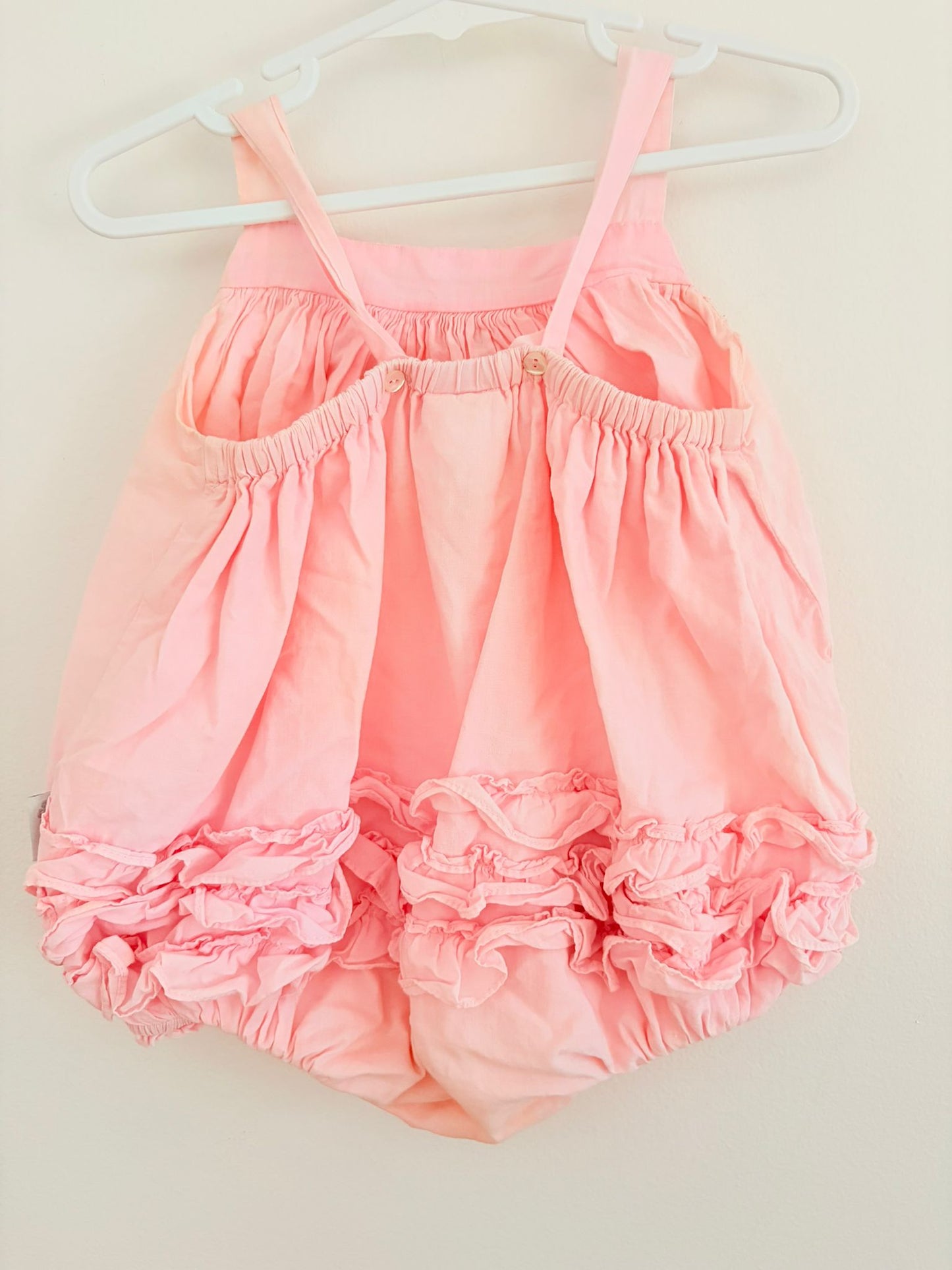 Size 00 Korango baby pink flower detail romper.