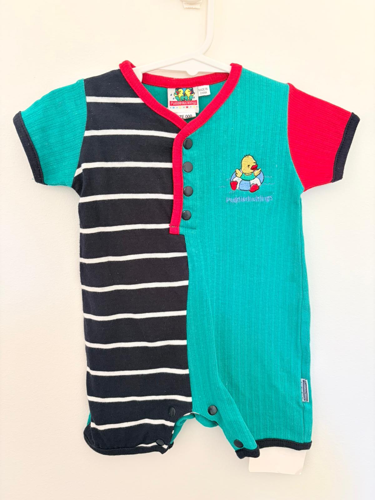 000 (new with tags) Puddle duckling’s vintage romper.