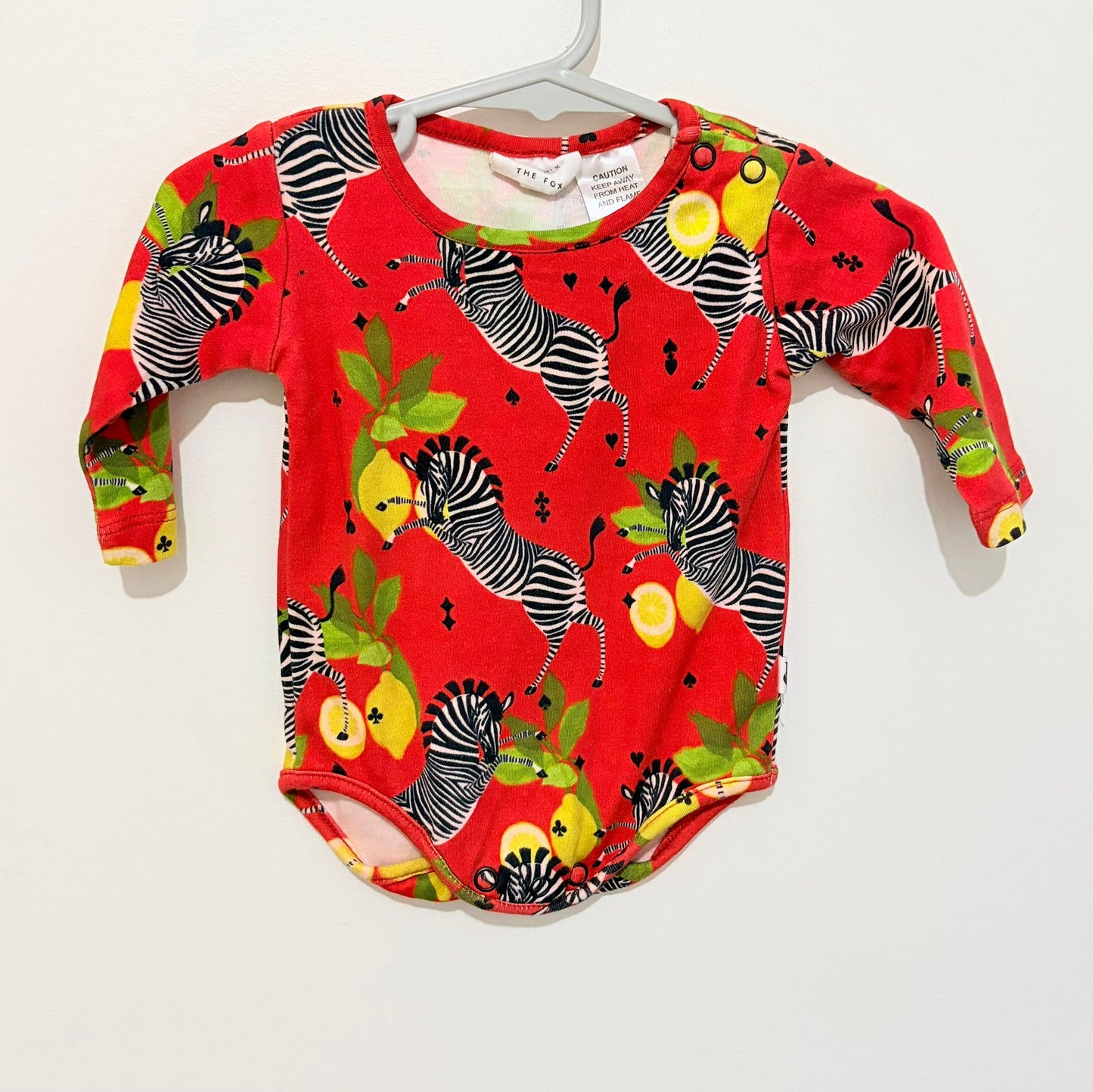 Size 000 Phoenix and the Fox long sleeve red zebra bodysuit.