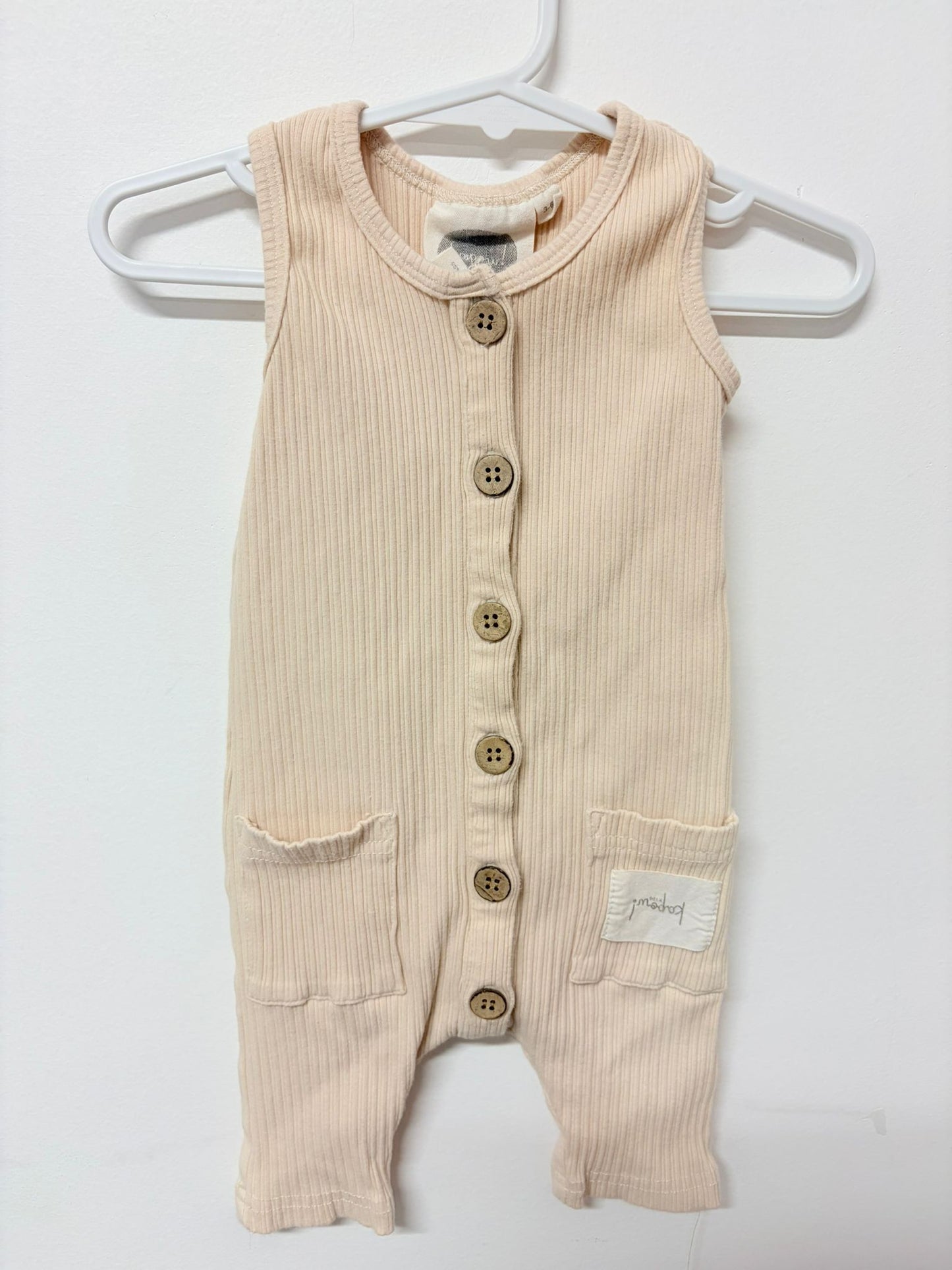 Size 00 Kapaow kids beige sleeveless onesie.