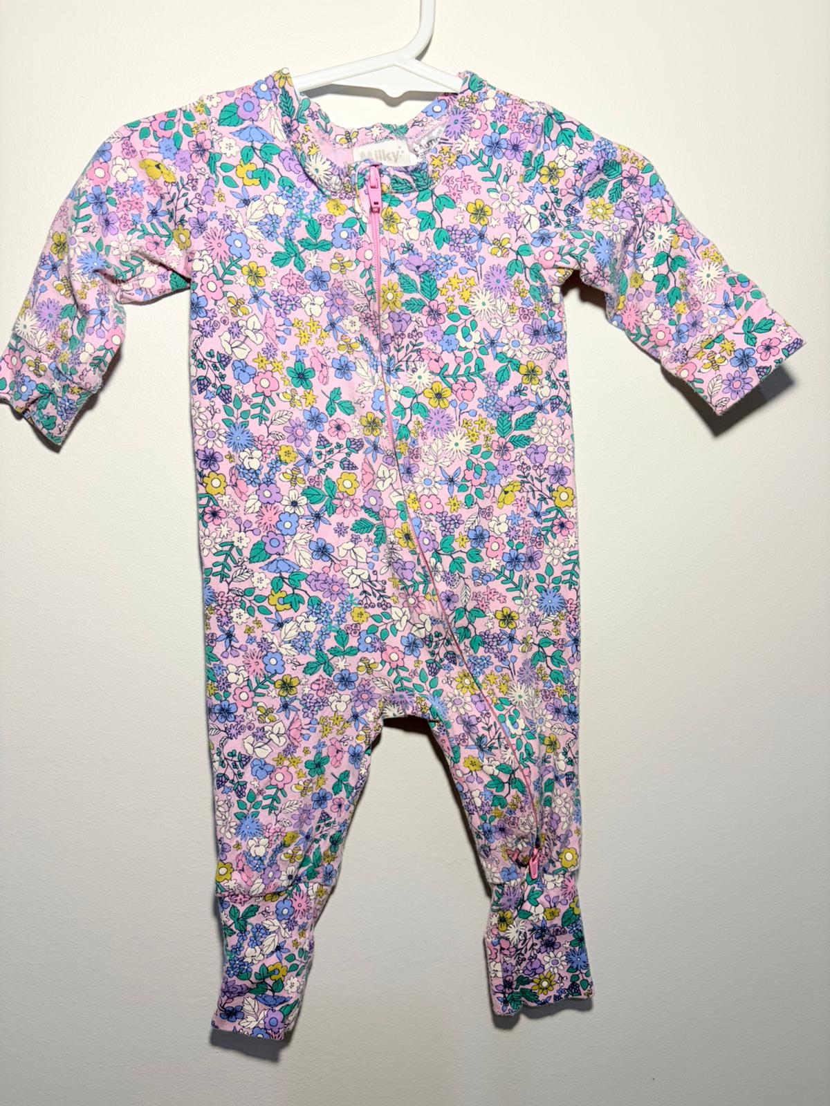00 Milky floral onesie.