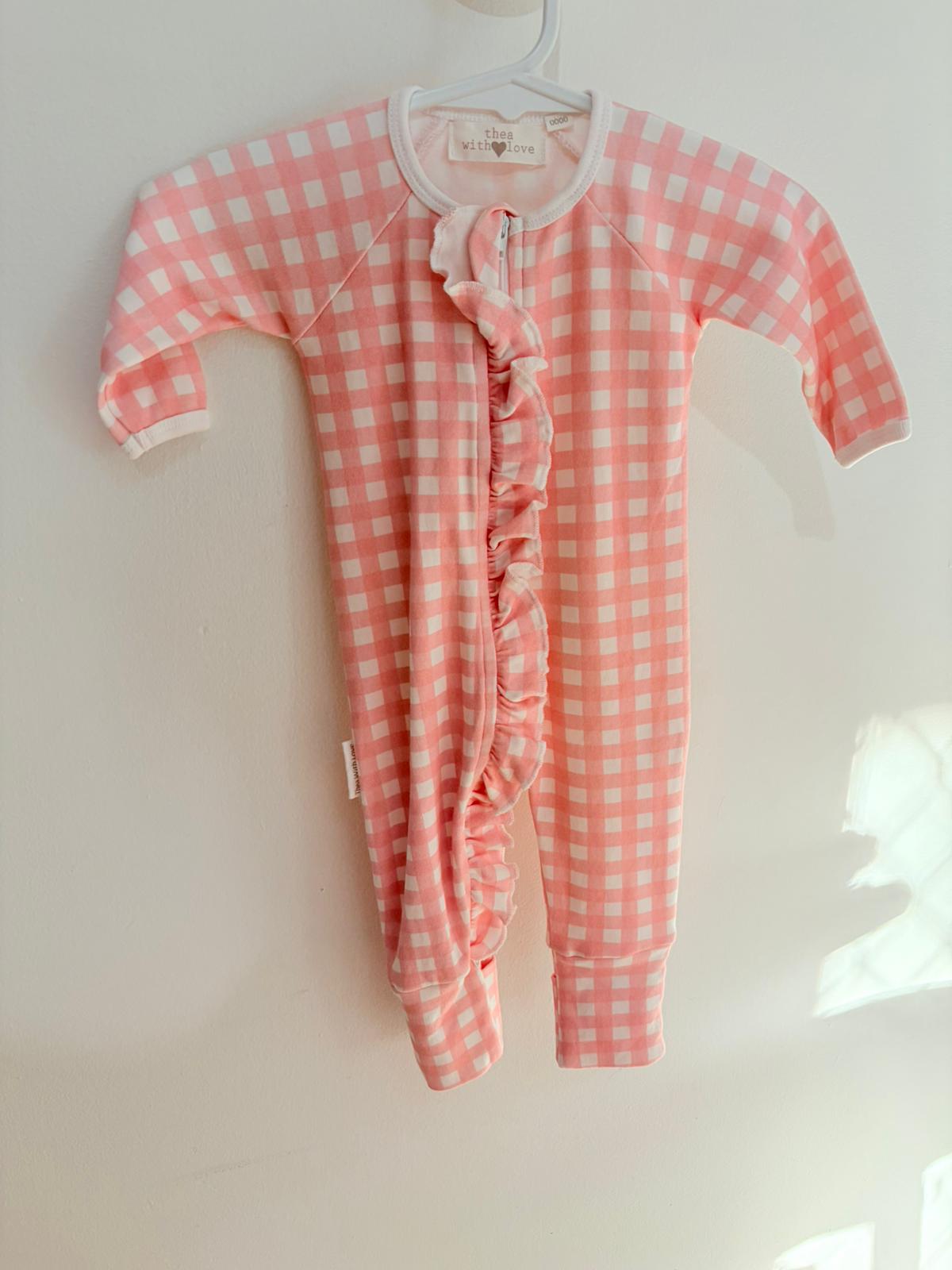 0000 Thea with love pink check onesie.