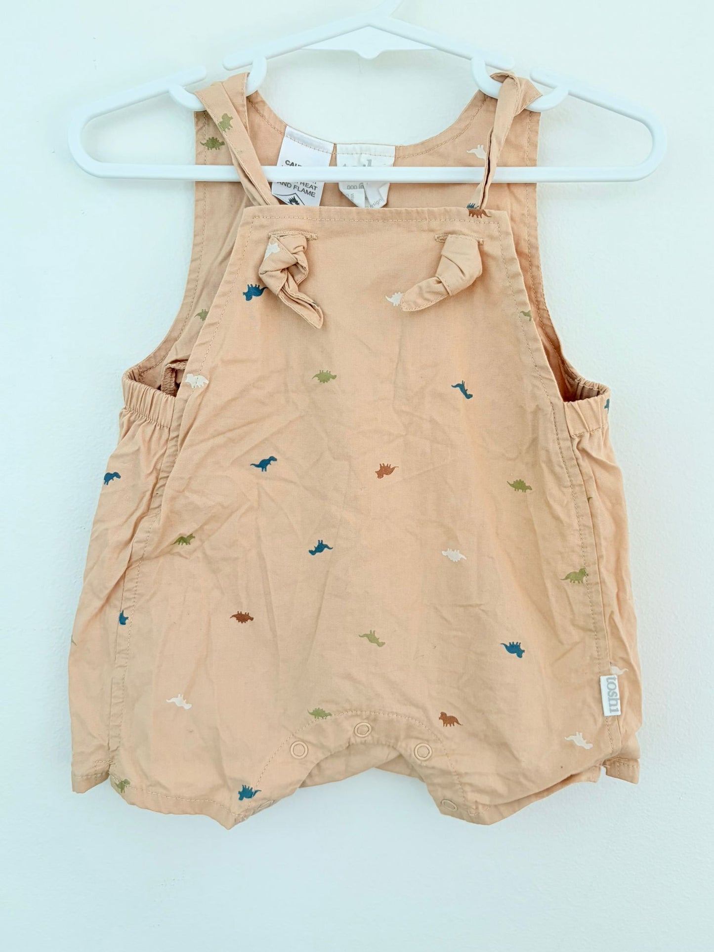 Size 00 Toshi sand cotton dinosaur print overall.