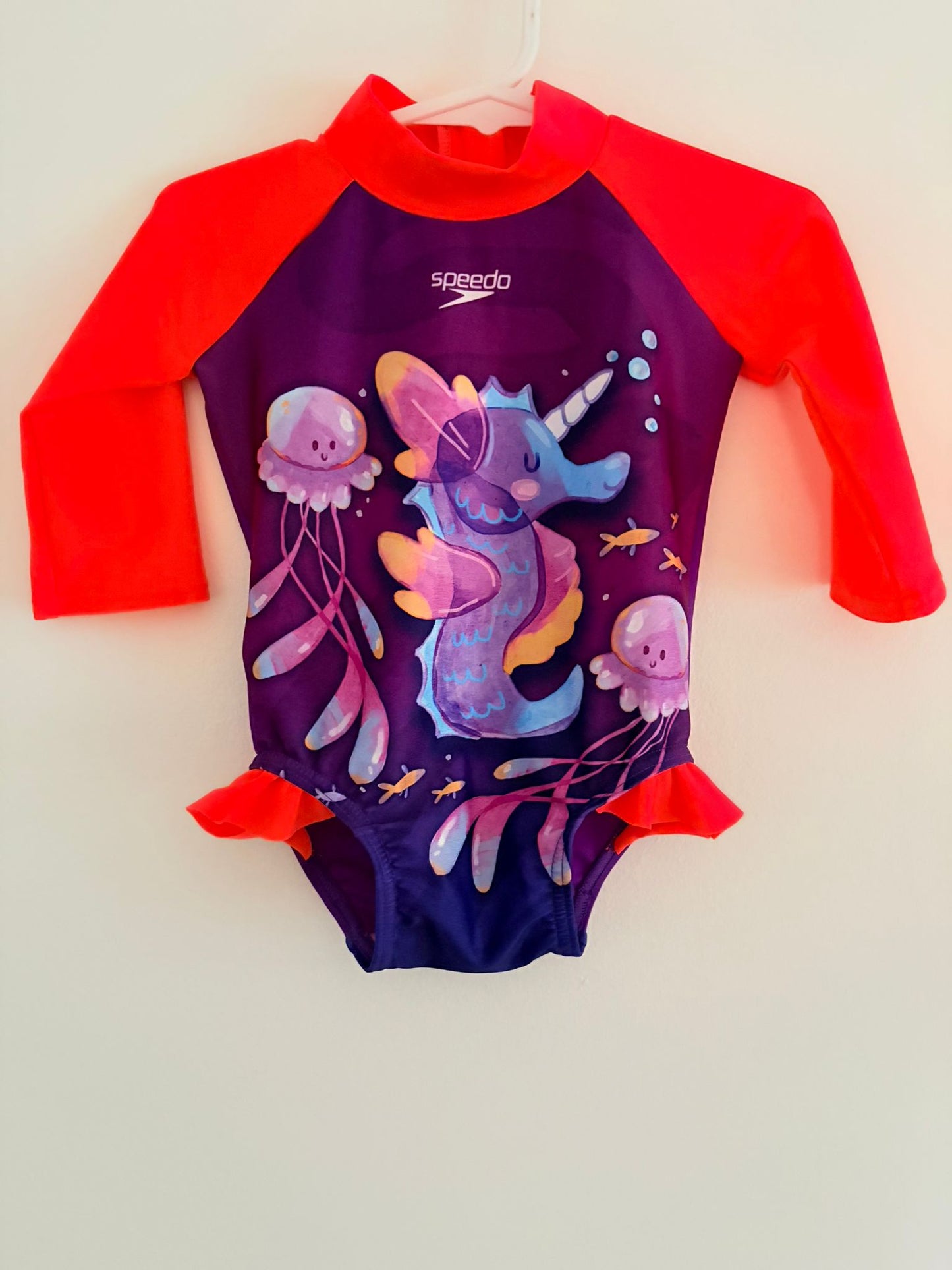 Size 0 Speedo purple and orange swimsuit with seahorse print.