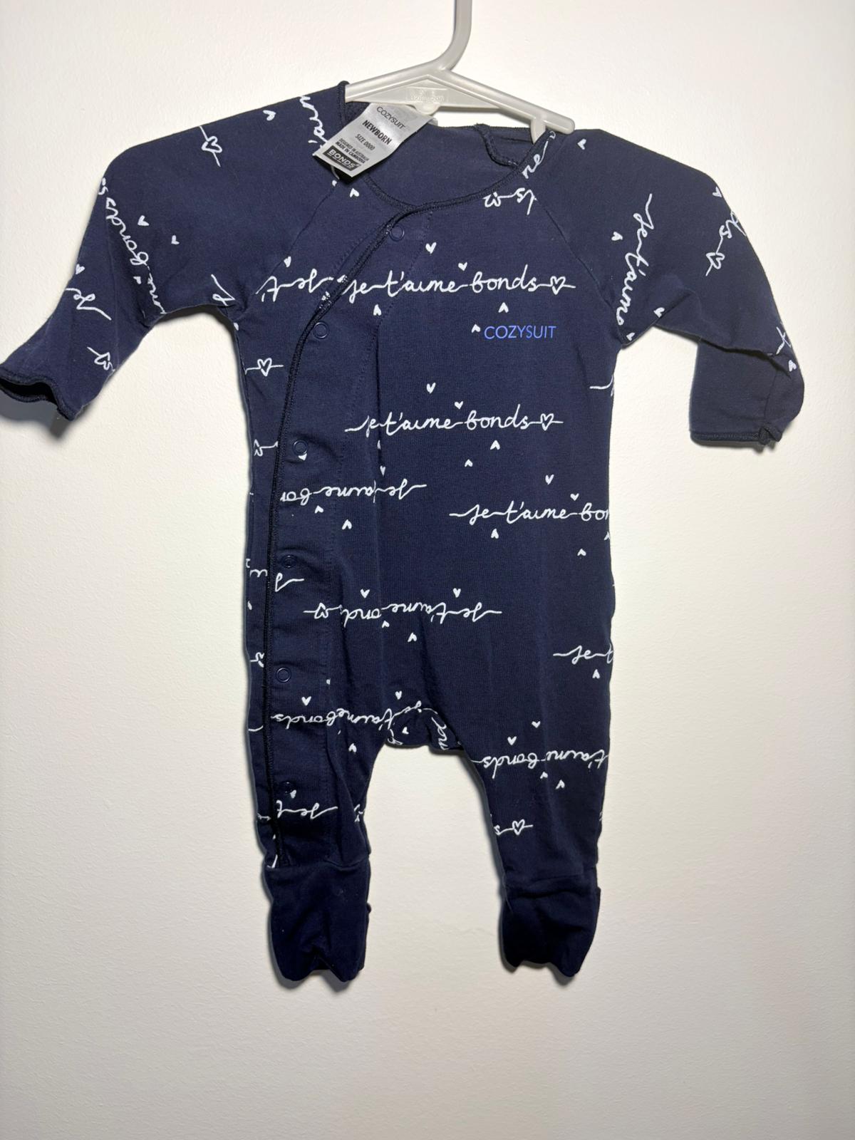 0000 Bonds cozysuit blue with white text print.