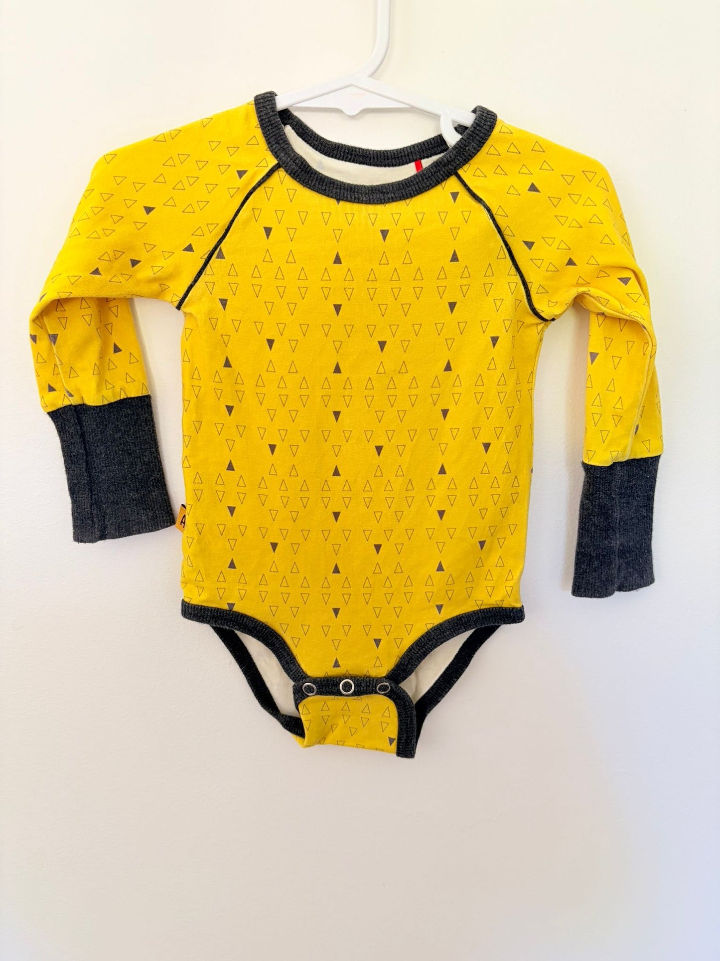 Size 0 ALABABY Yellow triangles long sleeved bodysuit.