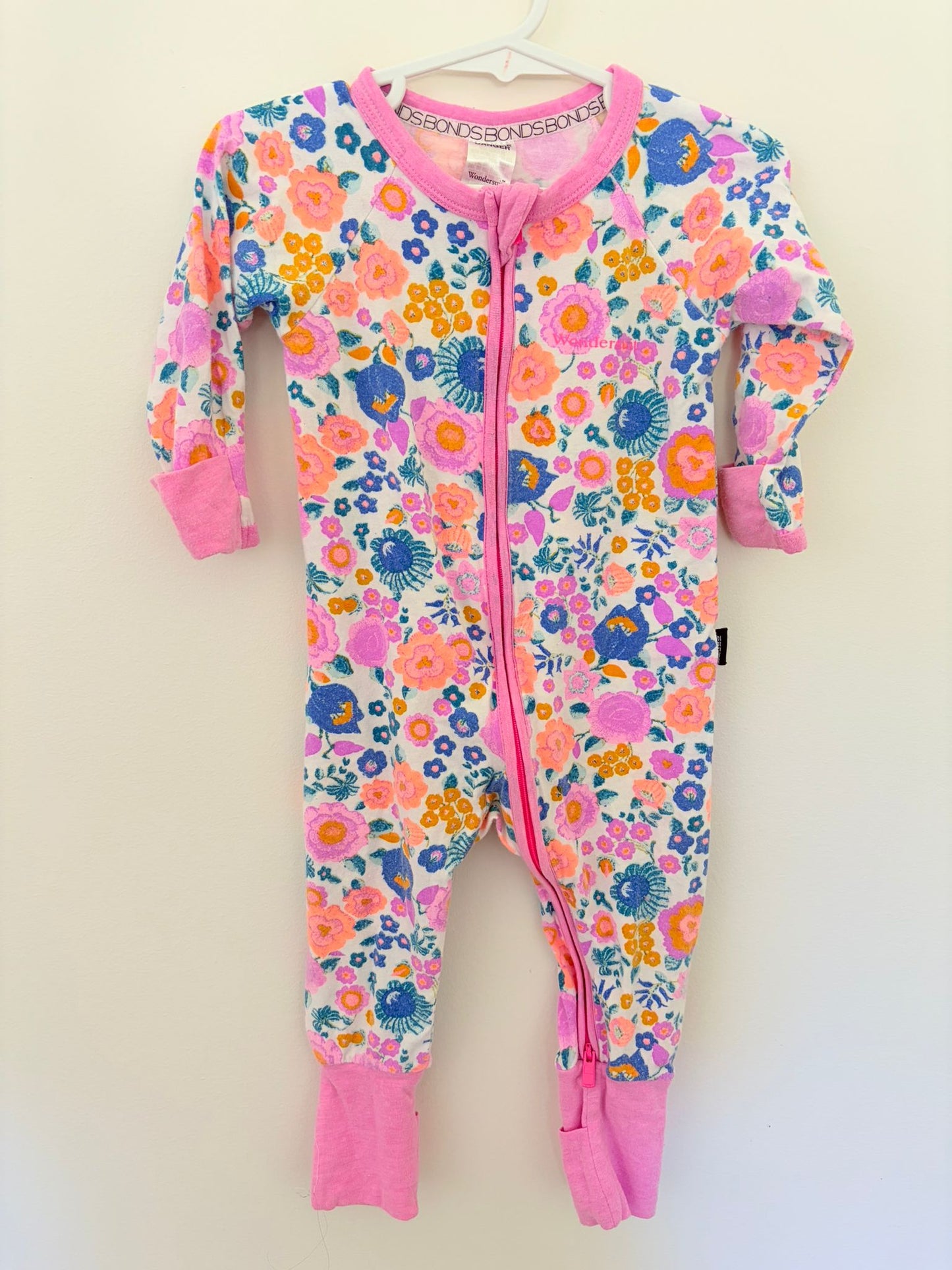 0 Bonds wondersuit flowers print with pink trim.