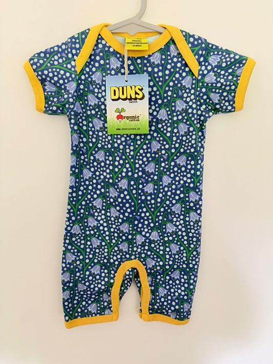 Size 00 (New with tags) DUNS Sweden organic cotton floral onesie yellow trim.