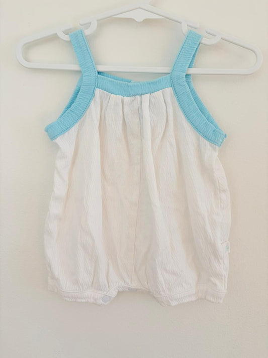 Newborn pumpkin patch white baggy romper with blue trim.