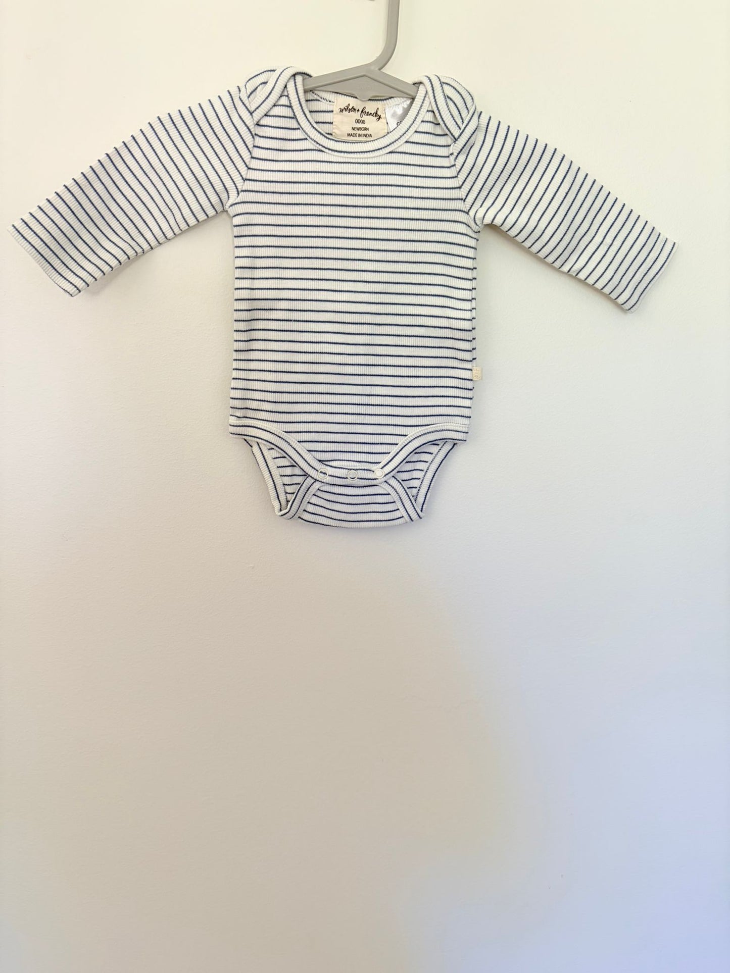 Newborn Wilson & Frenchy blue/white striped ribbed long sleeve bodysuit.