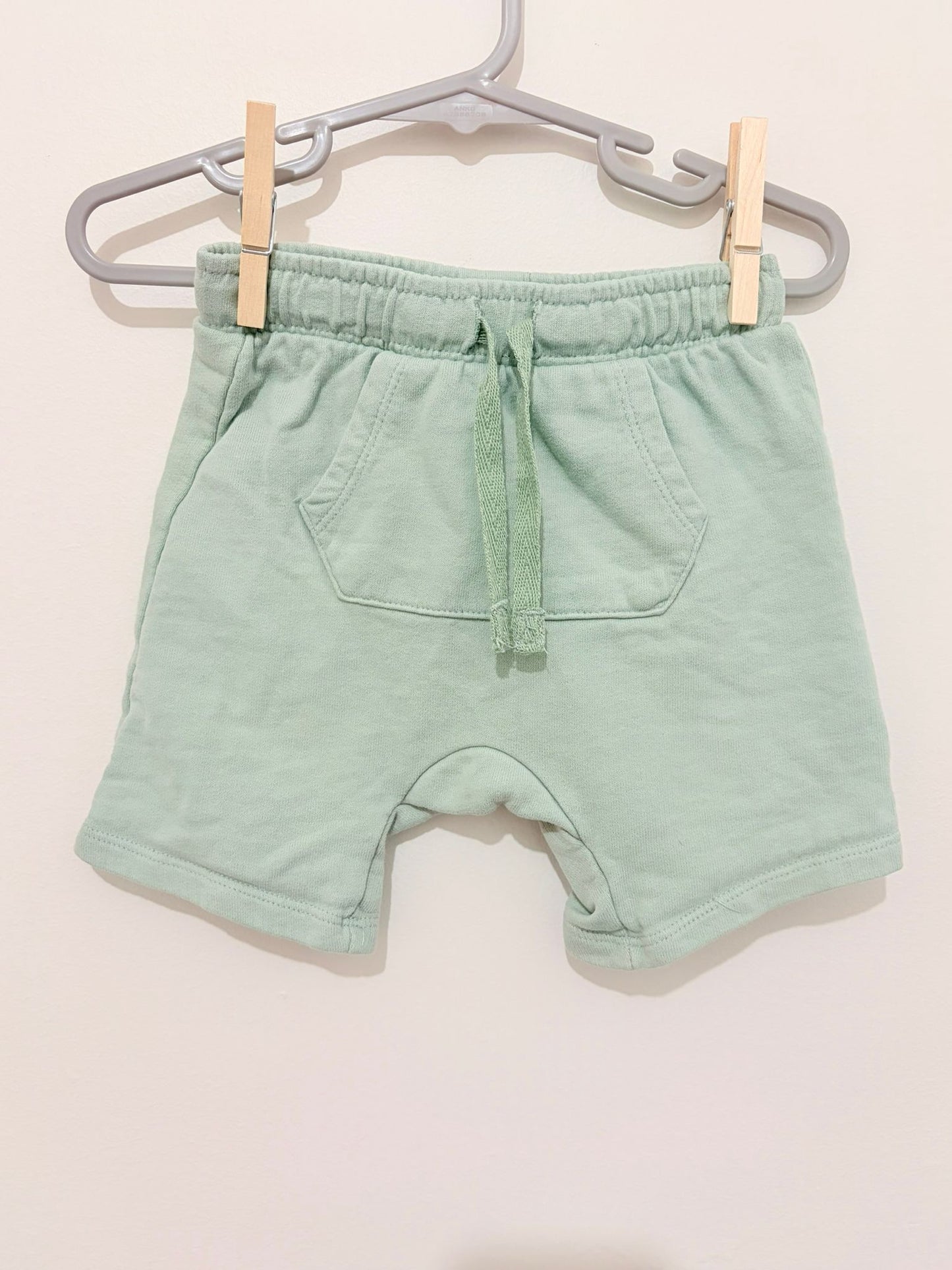 Size 2 Dymples plain light green shorts.