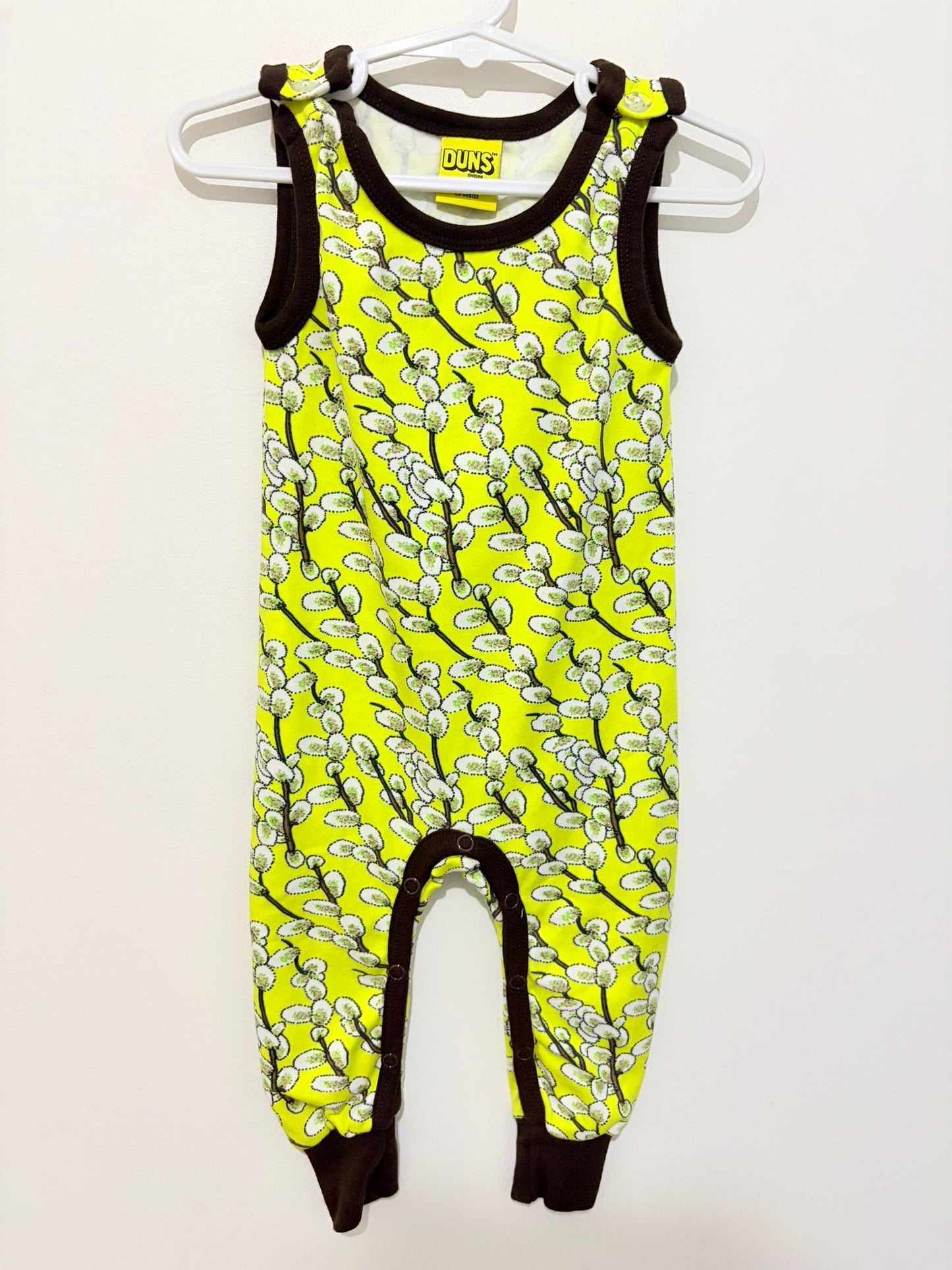 Size 00 Duns onesie yellow nature print.