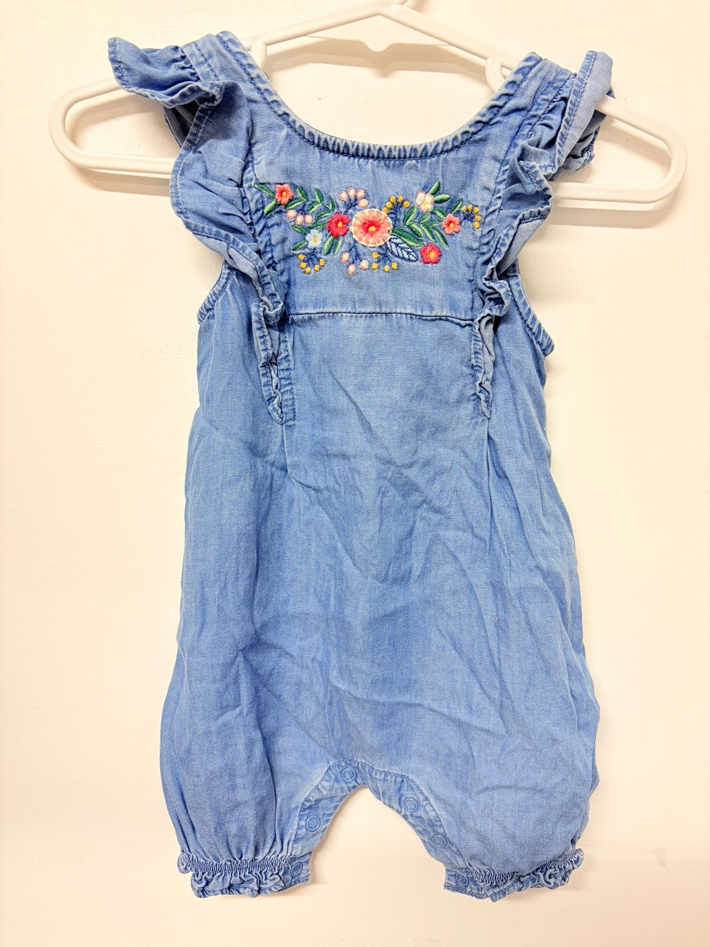 Size 00 No label denim romper with embroidery.
