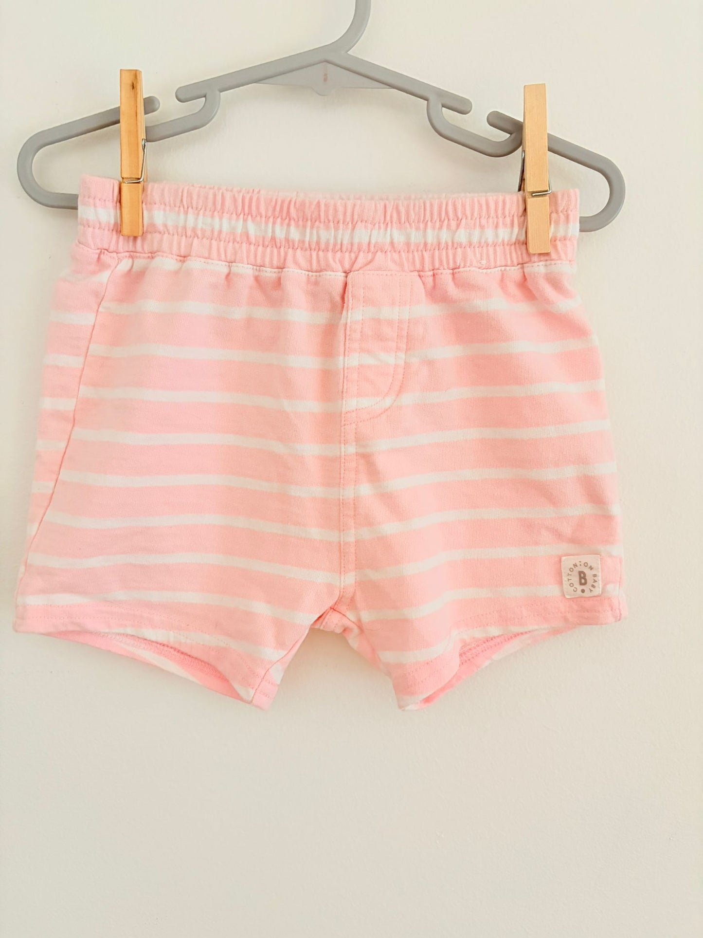 Size 1 Cotron on baby pink and white stripe shorts.
