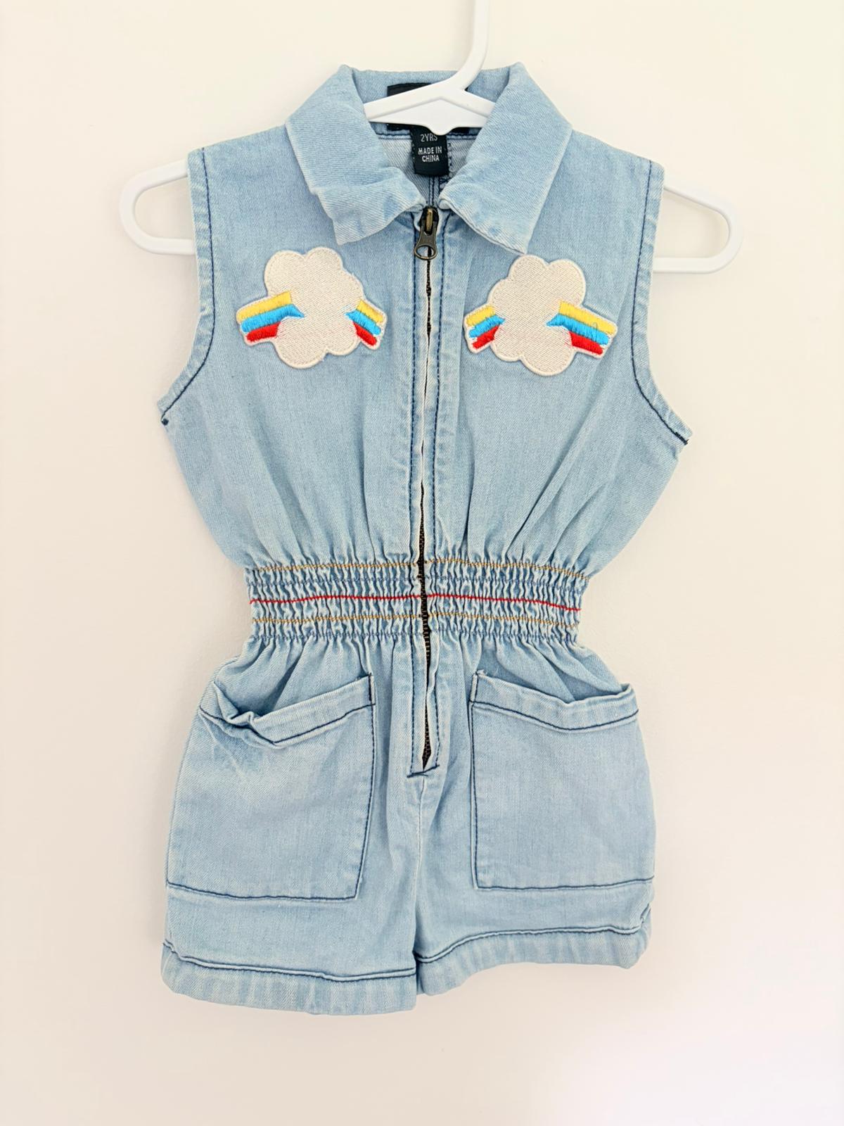 Size 2 Rock your Kid denim play suit with cloud rainbow motif.