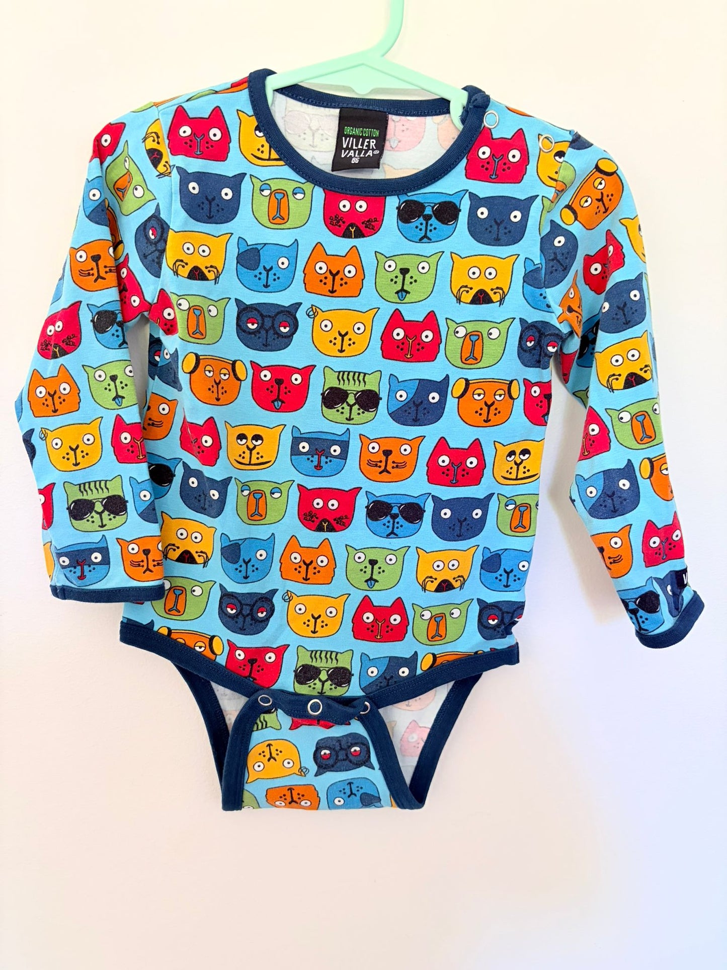Size 1 Villa Valla long sleeved blue bold Scandi dog print bodysuit.