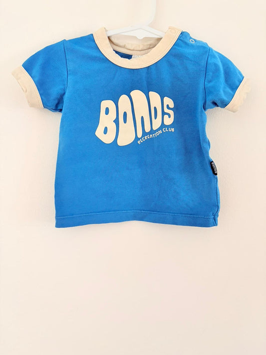 Size 000 Bonds slogan blue T-shirt.