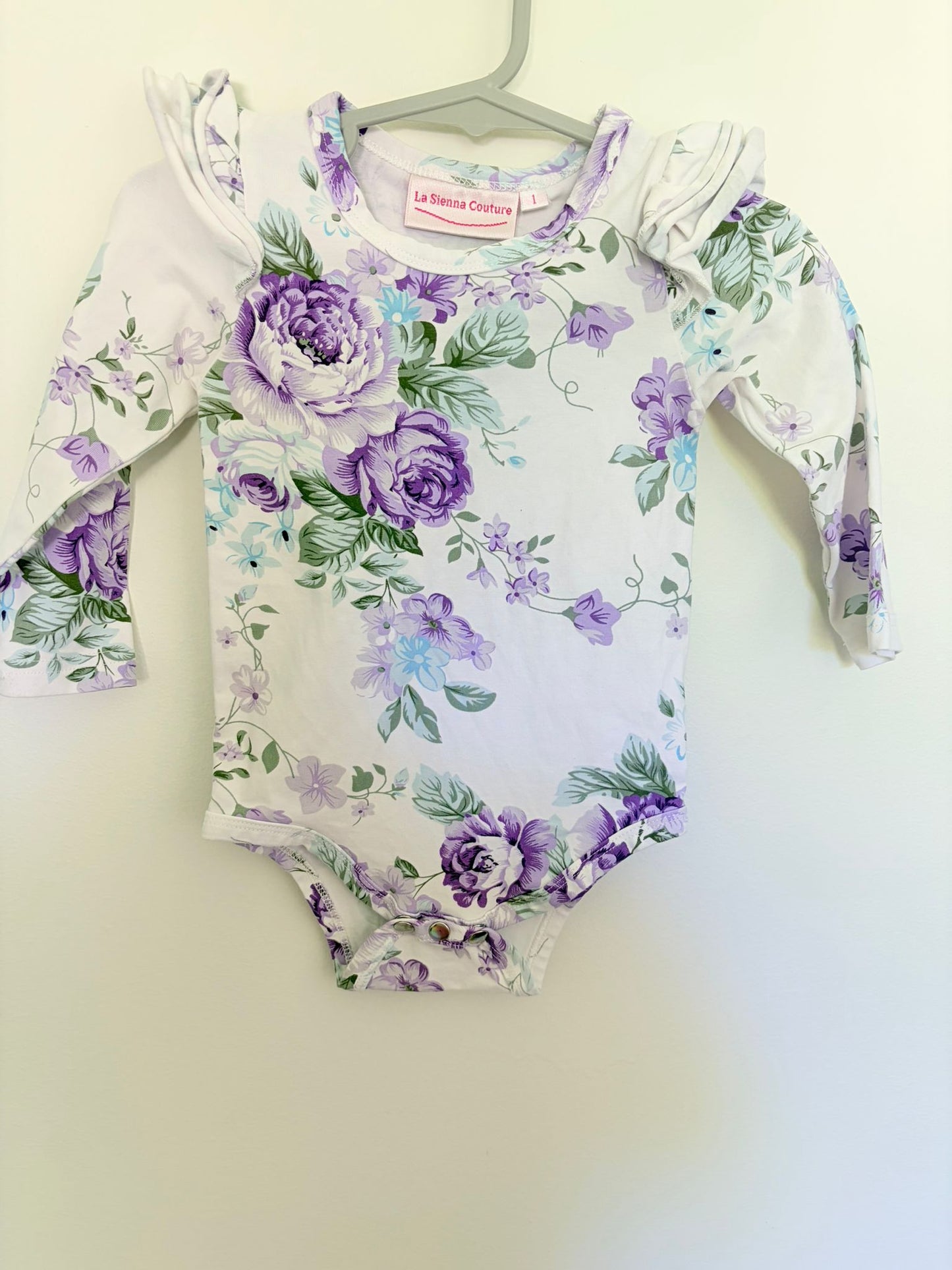 Size 1 La Sienna bodysuit white/purple bold floral print.