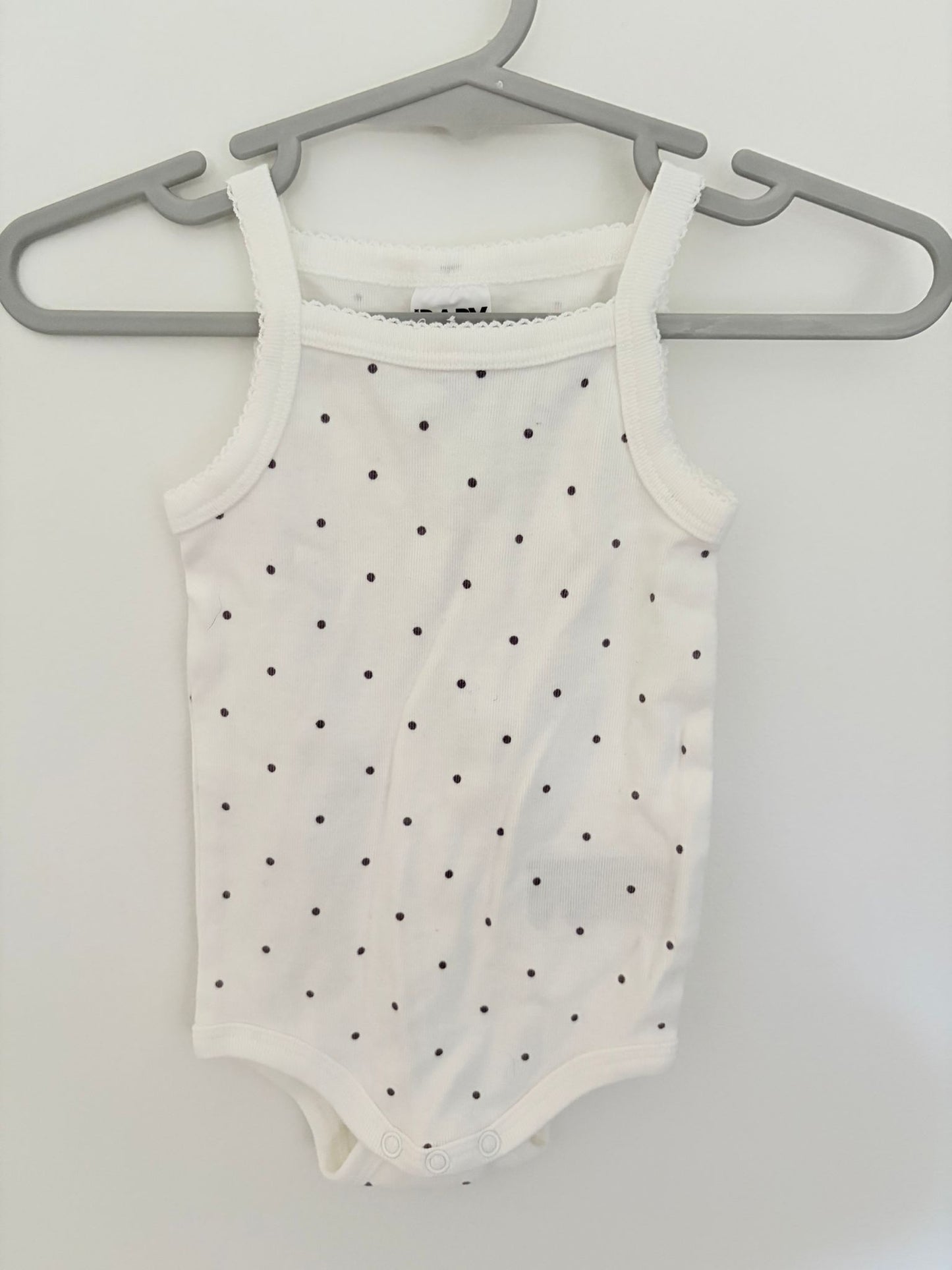 Size 000 Cotton on baby sleeveless body suit.