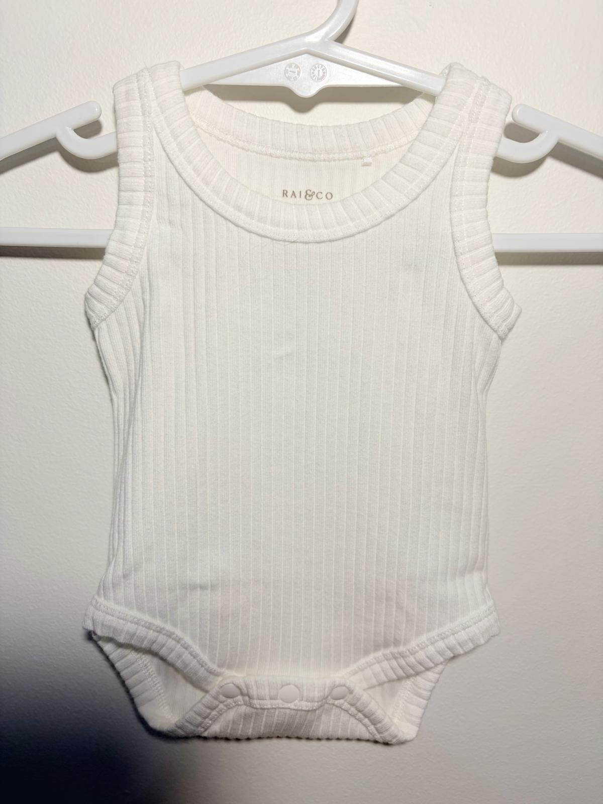 0000 Rai & Co. sleeveless white ribbed bodysuit.