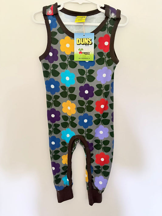 Size 0 (New with tags) DUNS Sweden organic cotton bold rainbow flower print onesie.