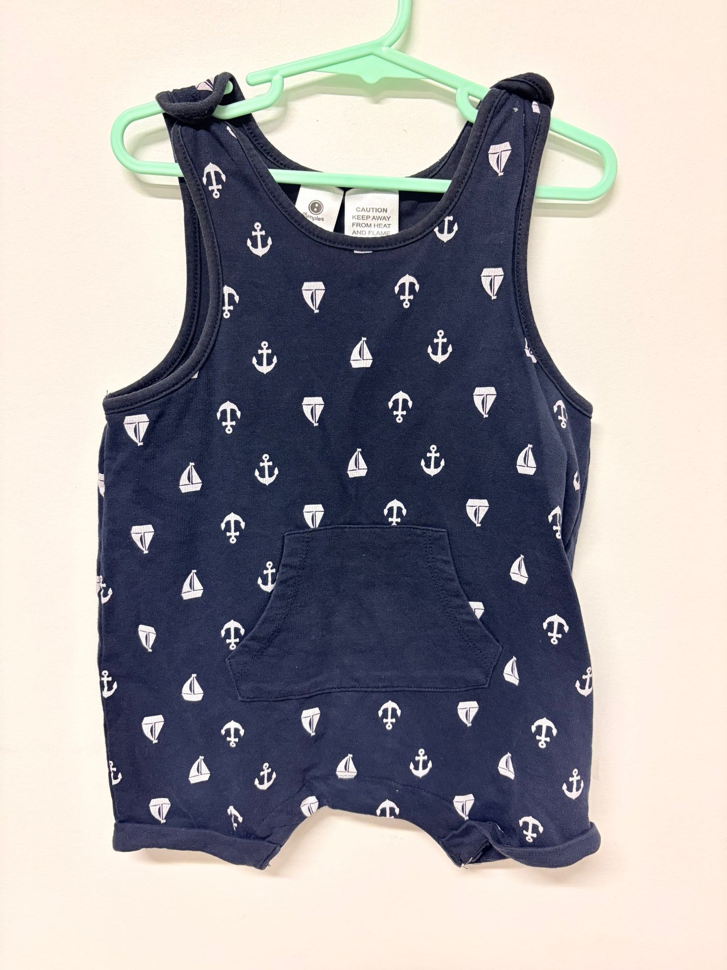 Size 2 Dymples Navy romper with white boat print.