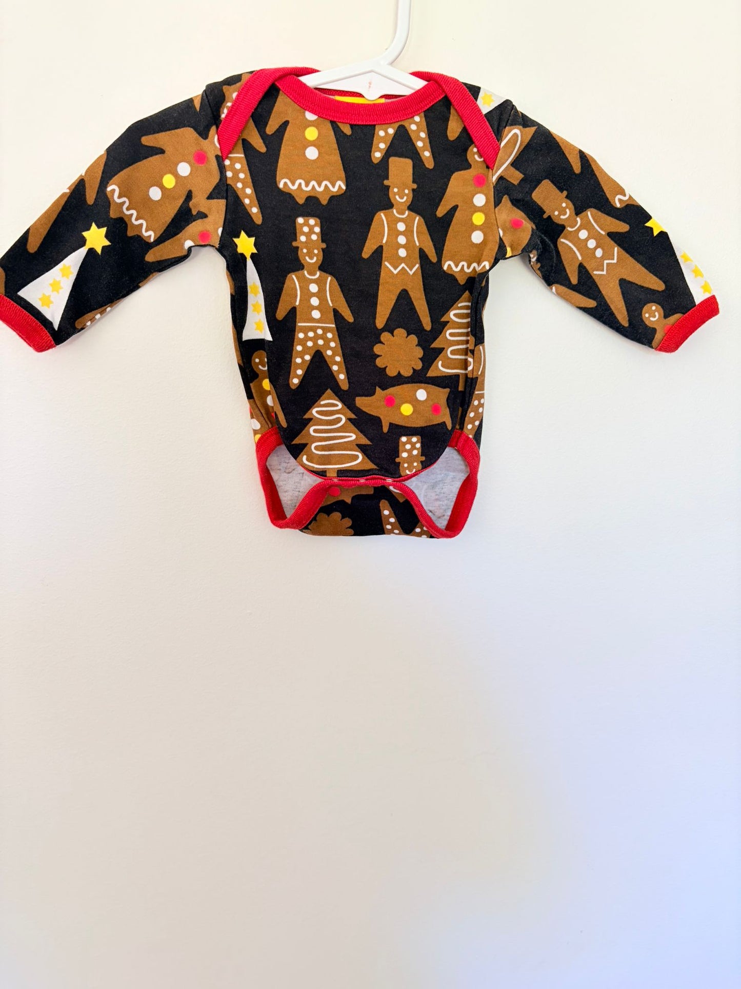 Newborn Duns Sweden black and brown print long sleeved bodysuit.