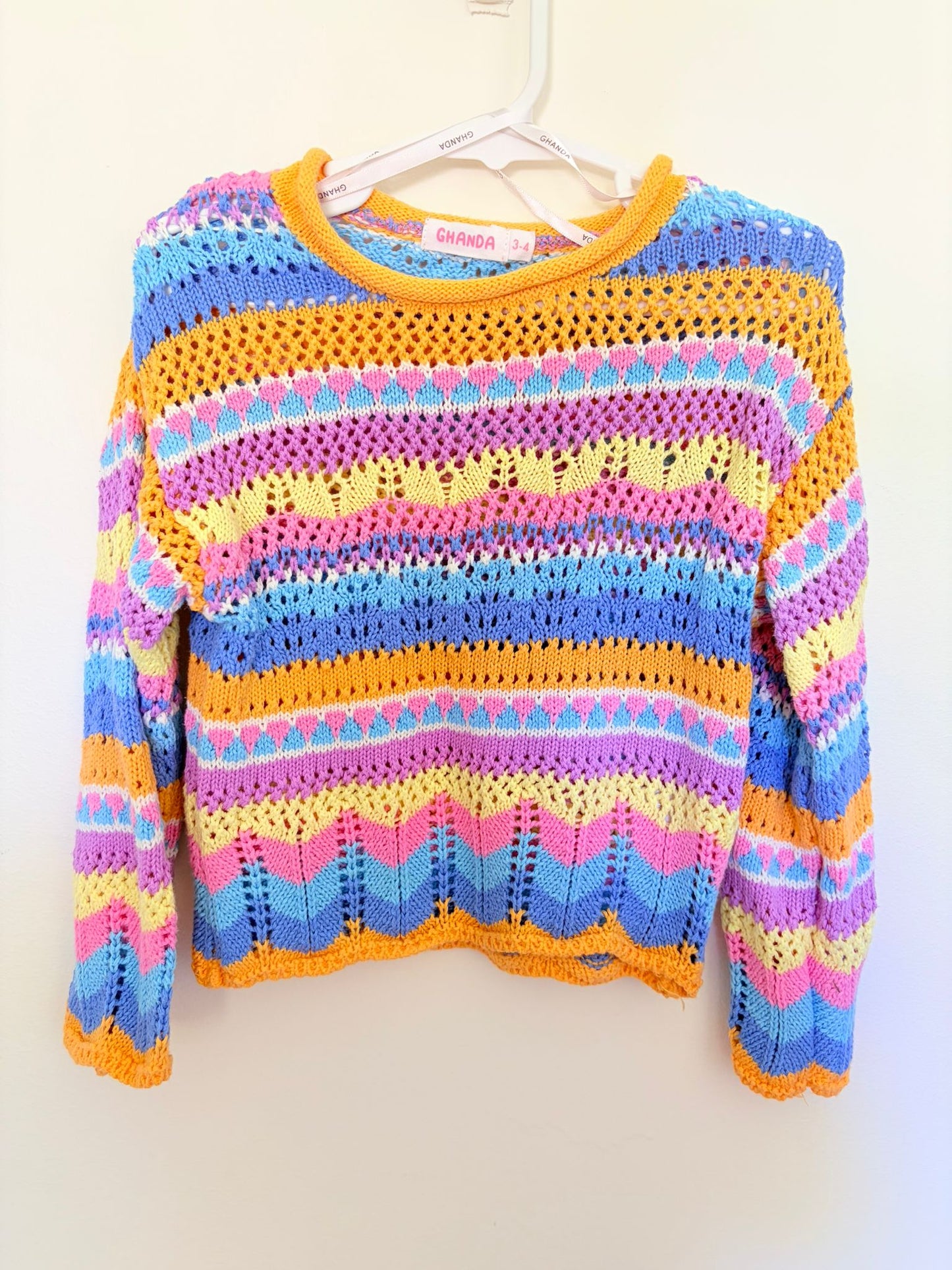Size 3 GHANDA Crochet jumper orange trim.