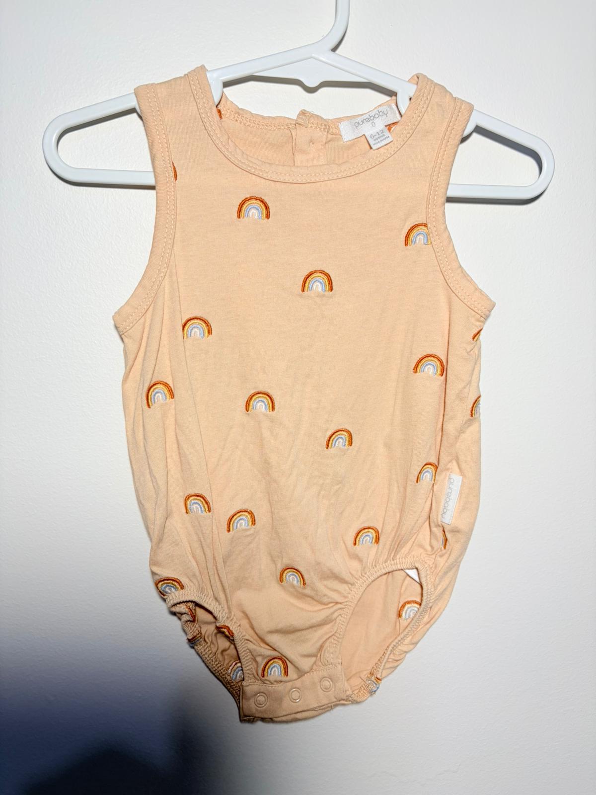 0 Purebaby sand bodysuit with rainbow embroidery.