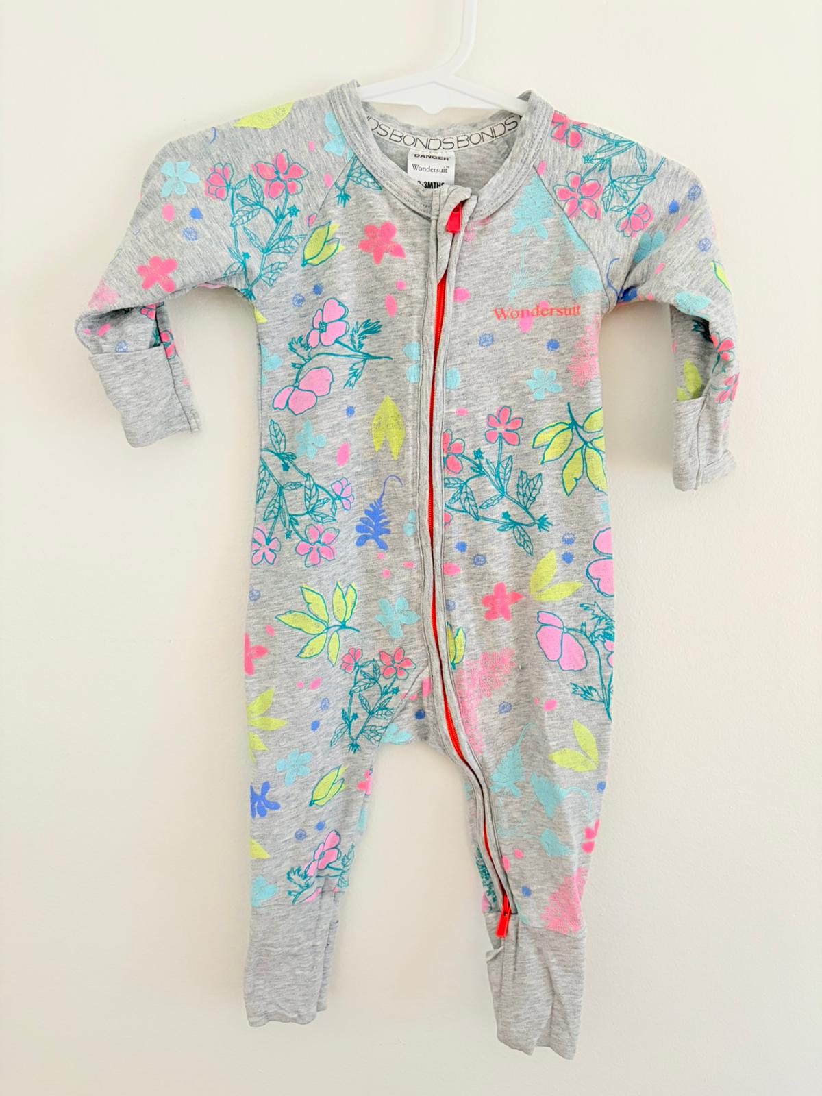Size 000 Bonds wondersuit grey with flower print.