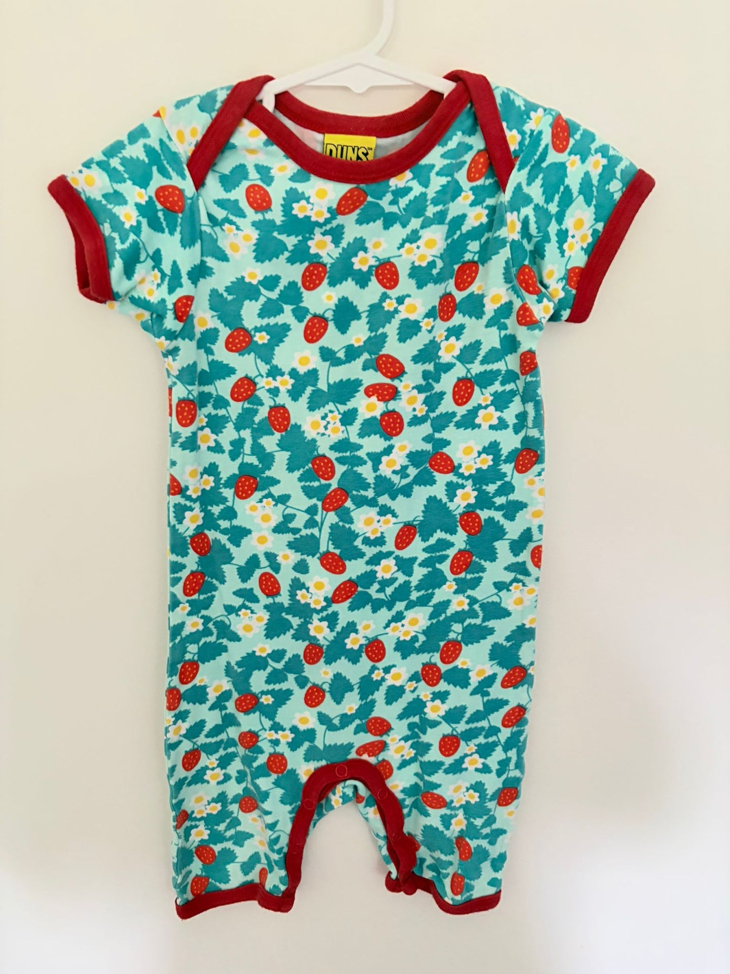Size 1 DUNS of Sweeden organic cotton strawberry print onesie.
