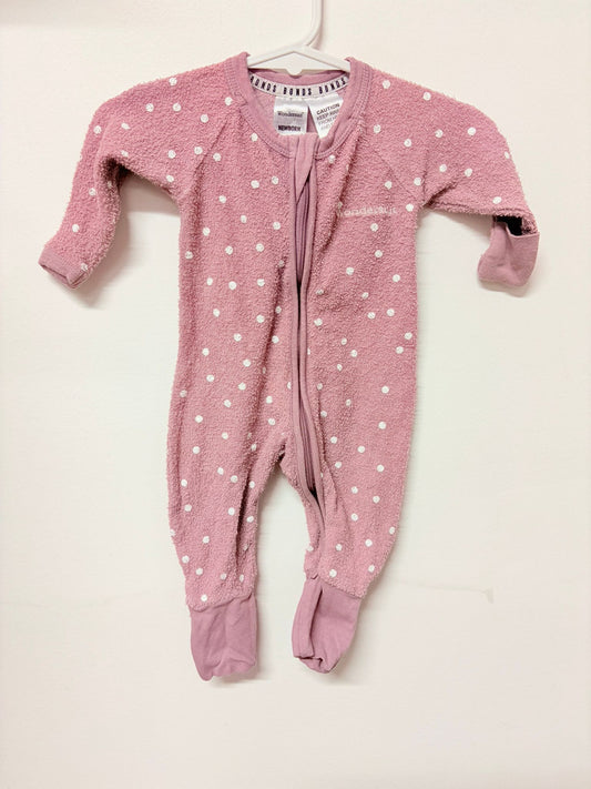 Newborn Bonds wondersuit pink with white dots.